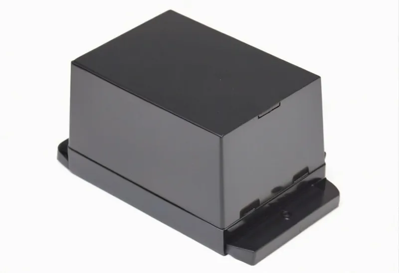 A black rectangular electronic device with a flat base.