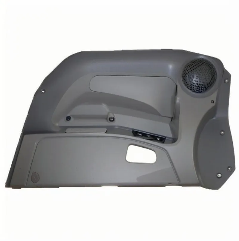 Gray car interior door panel with speaker and controls.
