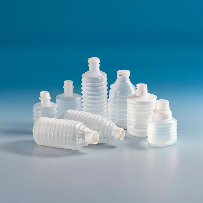 Various sizes of translucent ribbed squeeze bottles on a blue background.