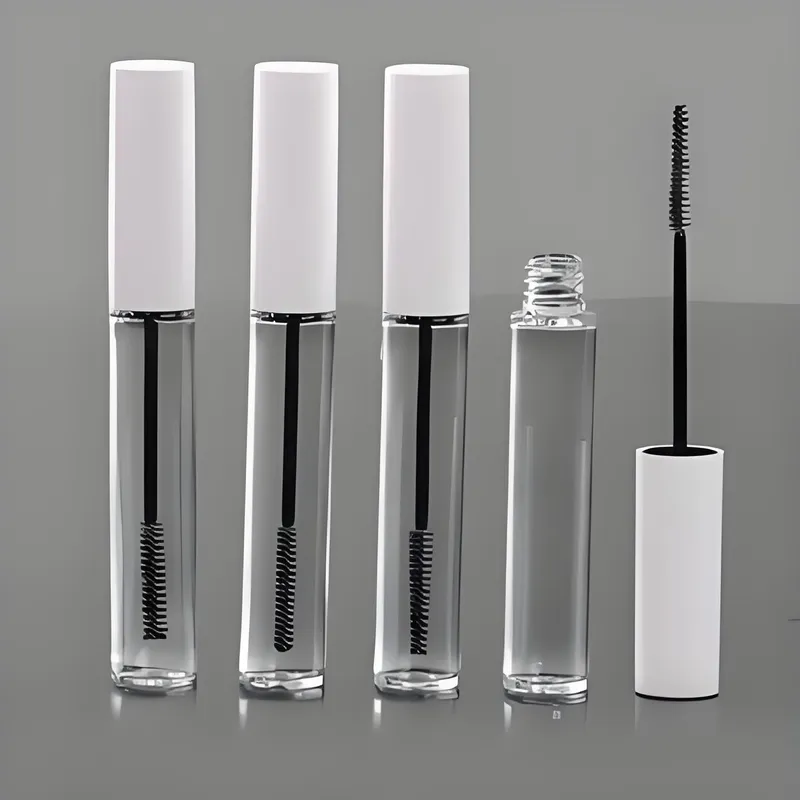 Four clear mascara tubes with white caps, one open showing the wand.