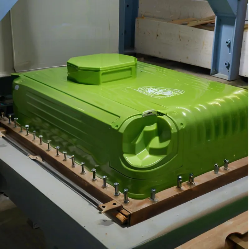 A green metal transformer housing secured with bolts in an industrial setting.