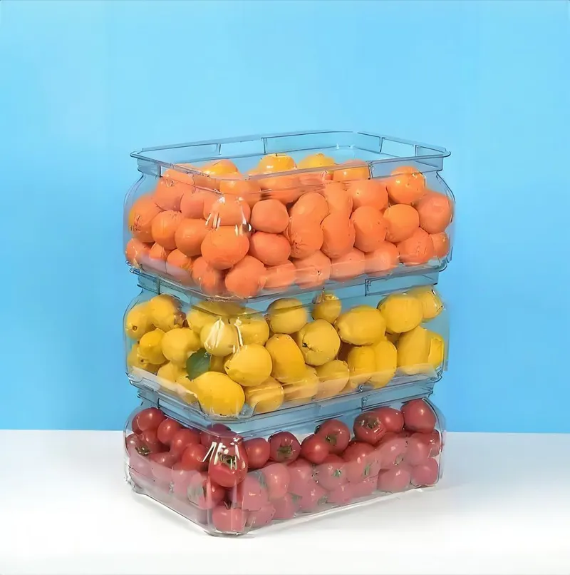 Three transparent containers stacked on top of each other, filled with oranges, lemons, and tomatoes against a blue background.
