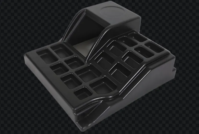 A black plastic mousetrap on a transparent background