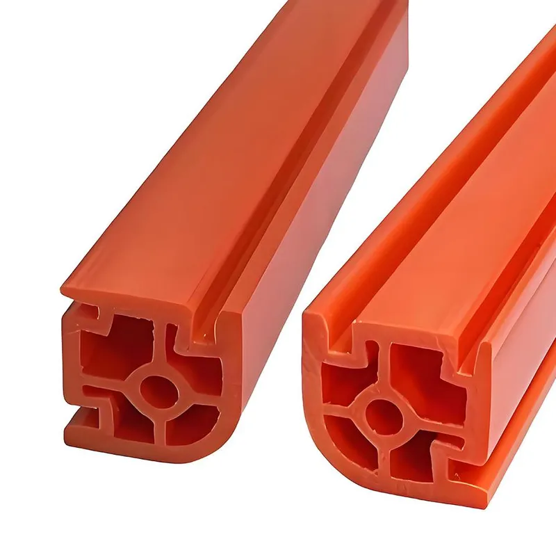 Two orange extruded plastic profiles with a cross-sectional design.