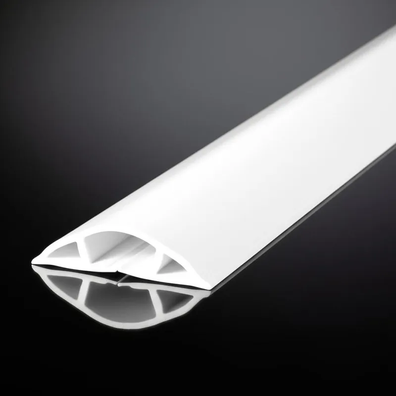 A white cable cover laying on a reflective black surface, with a structured arch design.