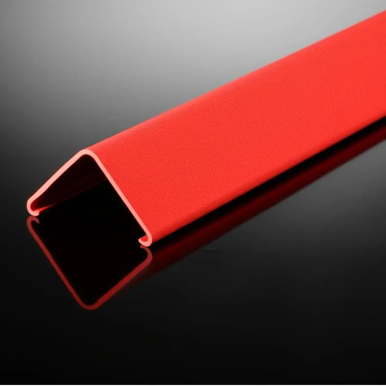 A red rubber u-shaped garage door seal on a reflective black surface.