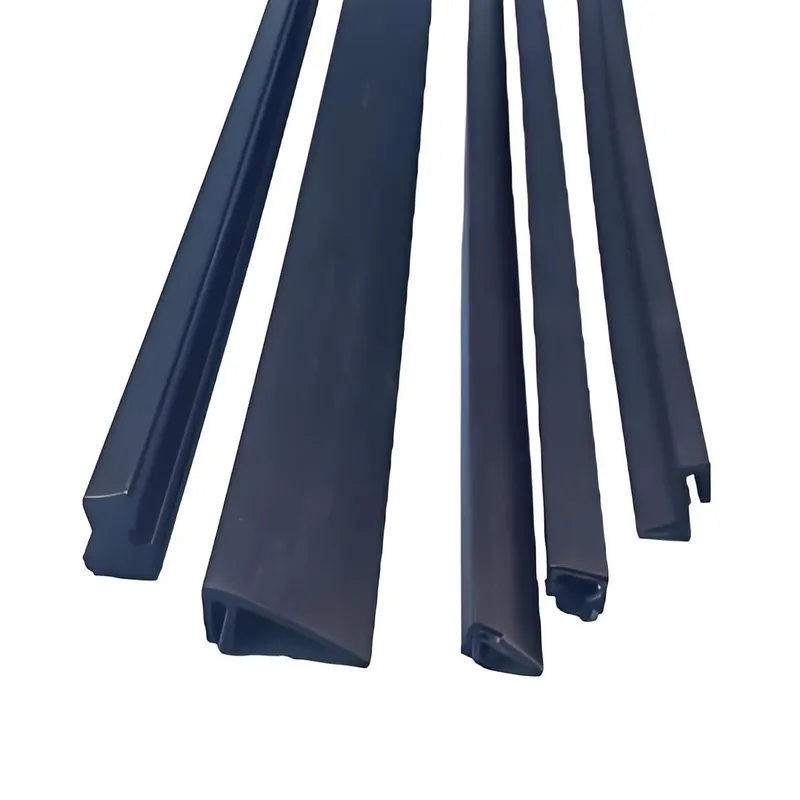 A collection of black rubber seal strips arranged on a white surface.