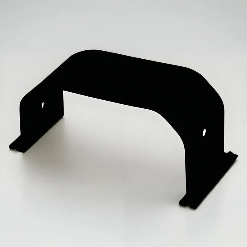 A U-shaped black metal bracket with holes on each side, placed on a light surface.