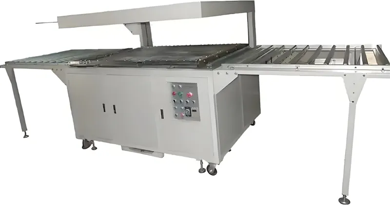 Large industrial heat shrink machine with a conveyor belt system and control panel