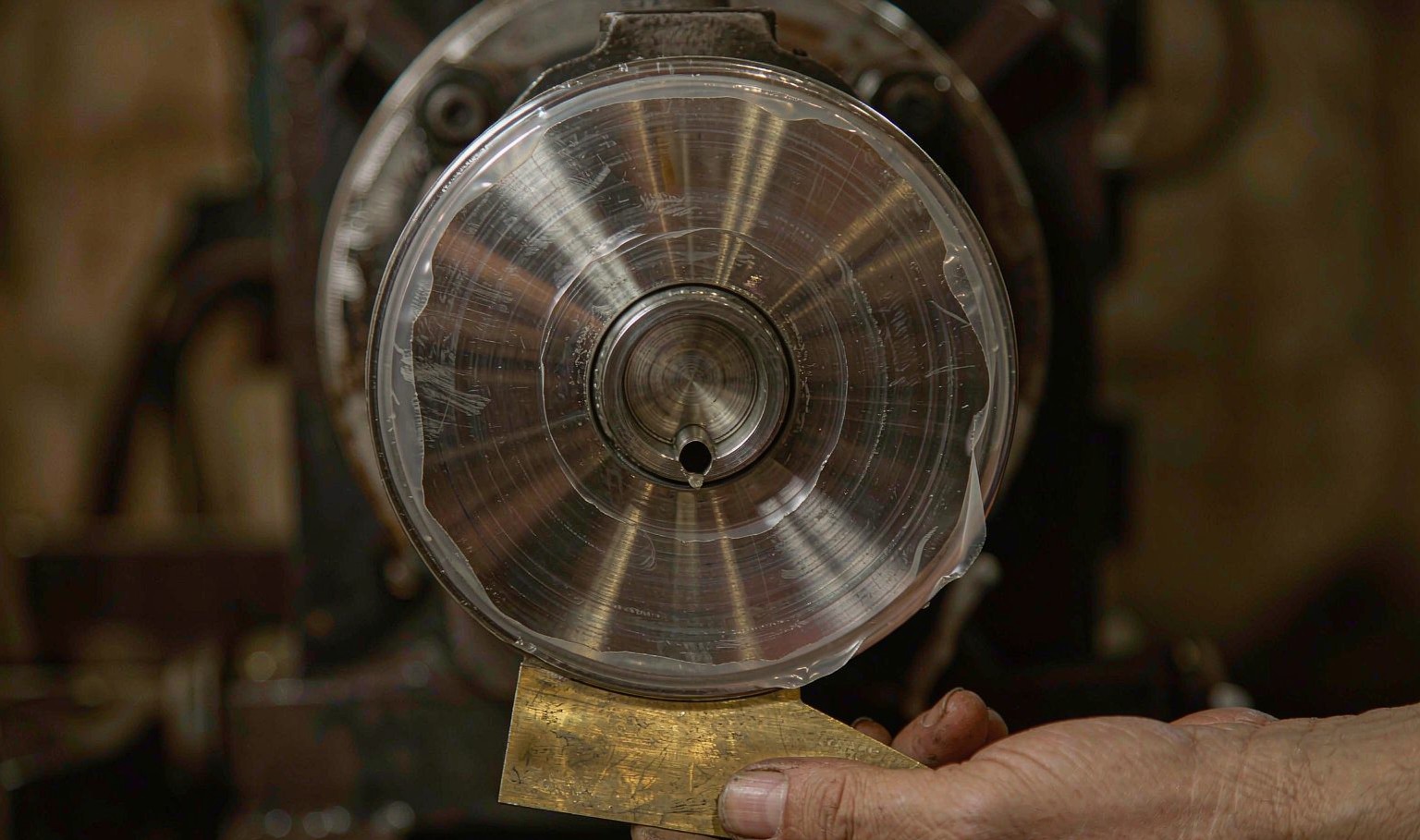 Extrusion die head for a PVC profile mounted on the extruder flange, with the flow channel and land visible