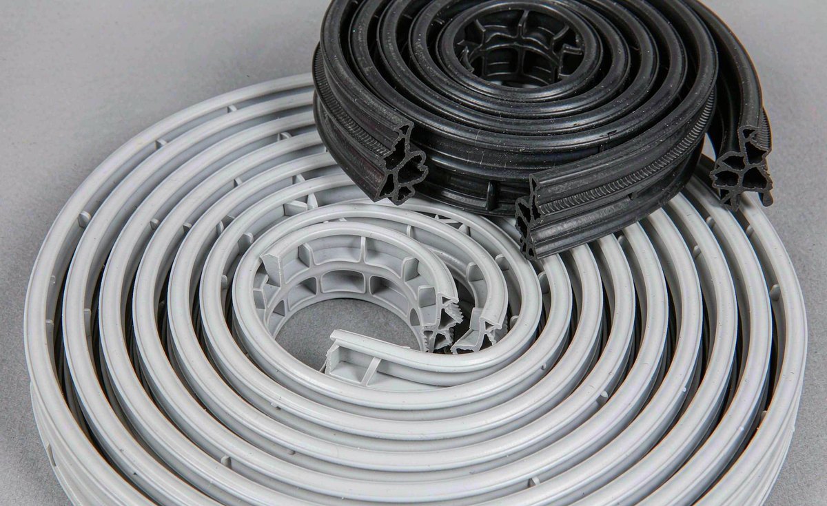 Coiled white silicone rubber extrusion profiles and a black silicone sealing strip